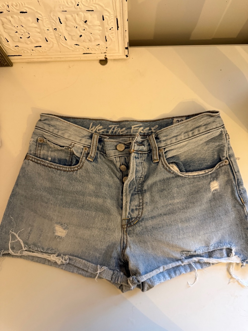 We The Free Light Wash Distressed Denim Cutoff Shorts